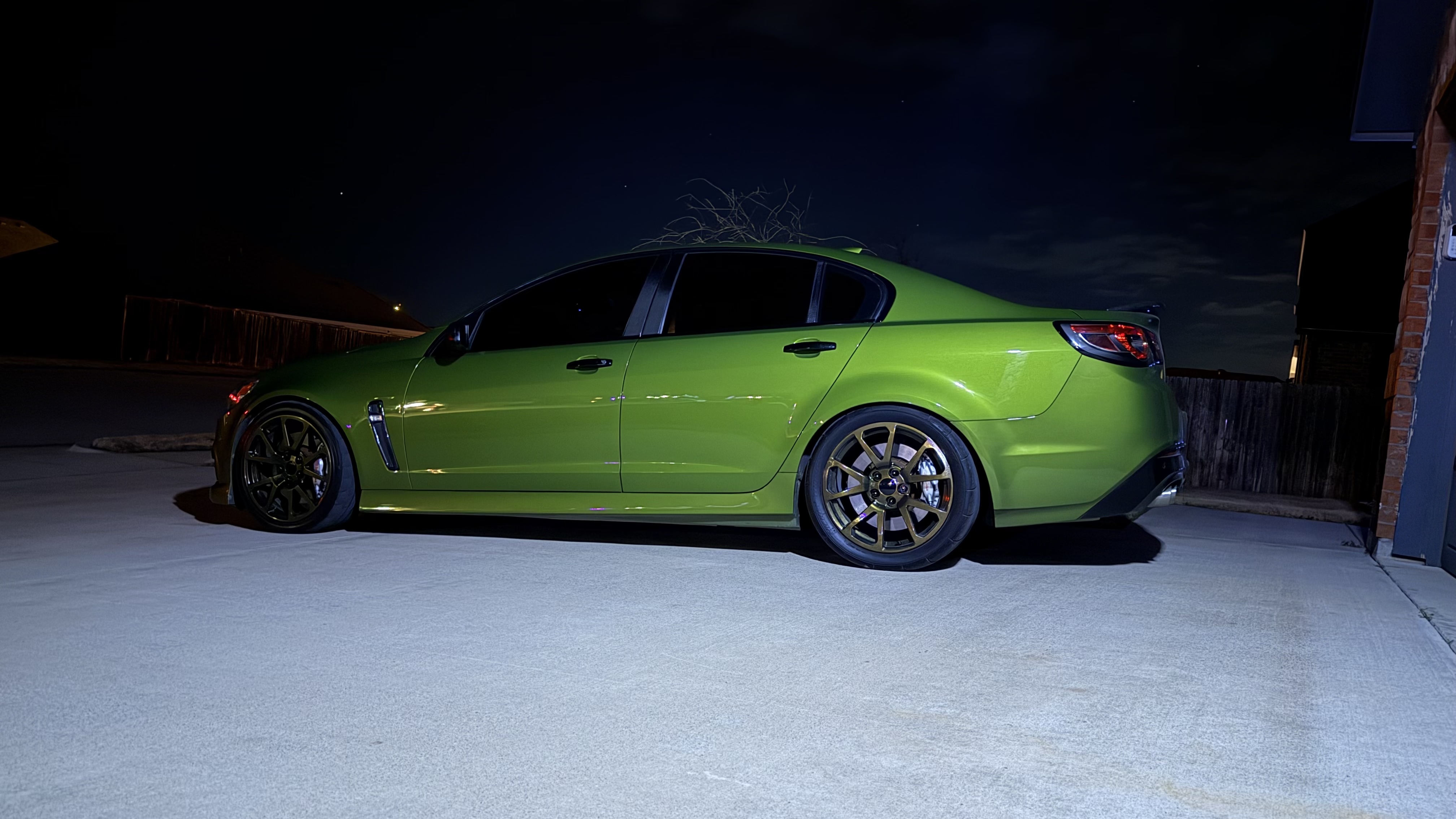 2015 Chevrolet SS in Jungle Green - front three-quarter view